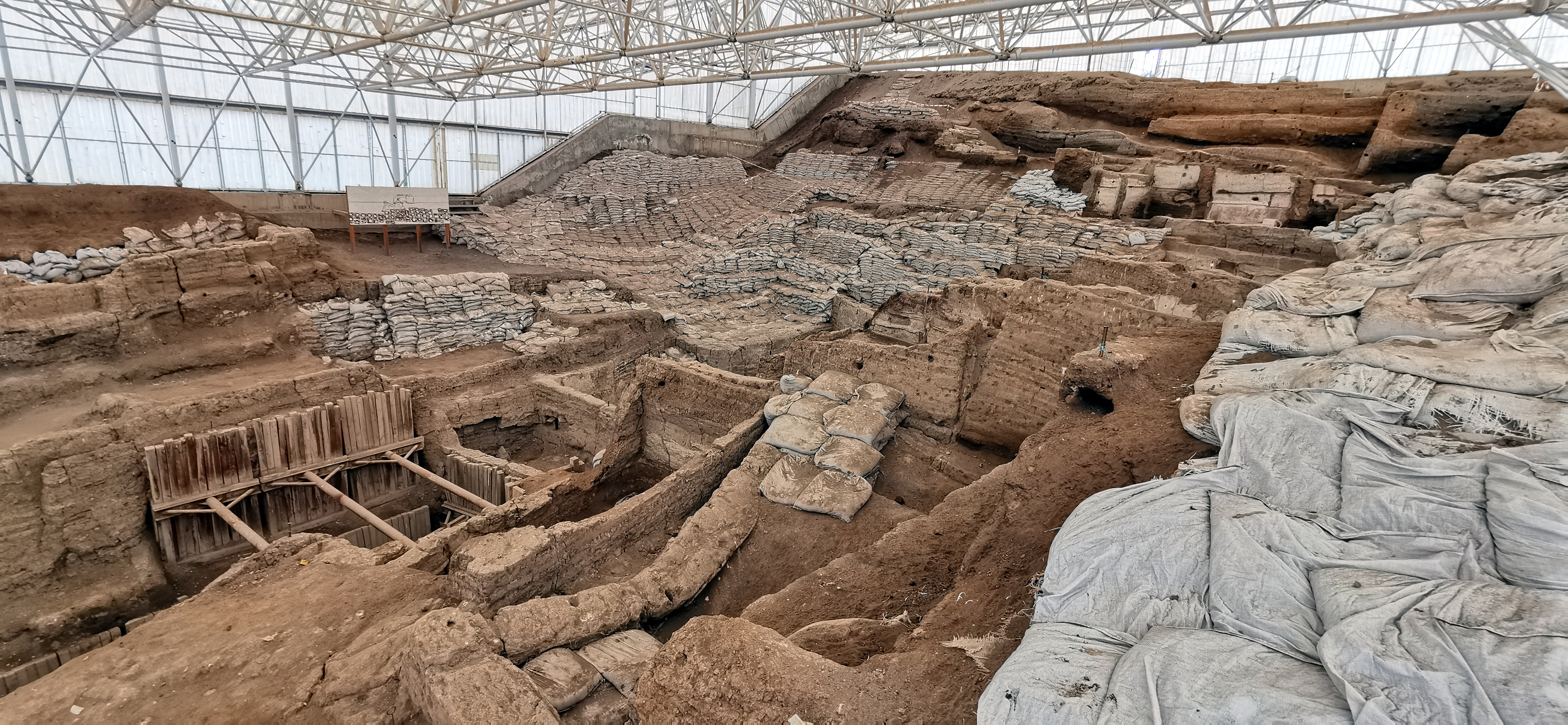 Archaeological excavation at Catalhoyuk showing the dense, streetless settlement layout